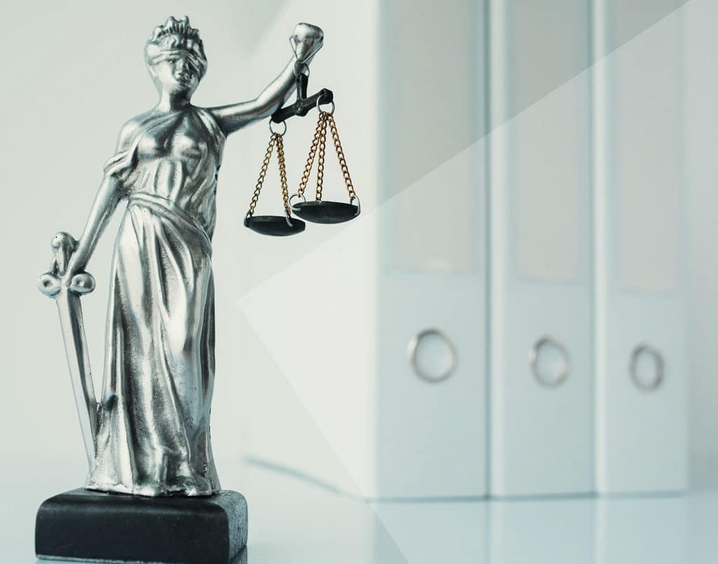 Lady Justice statue in law firm office